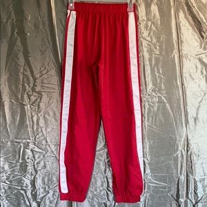 Red track pants
